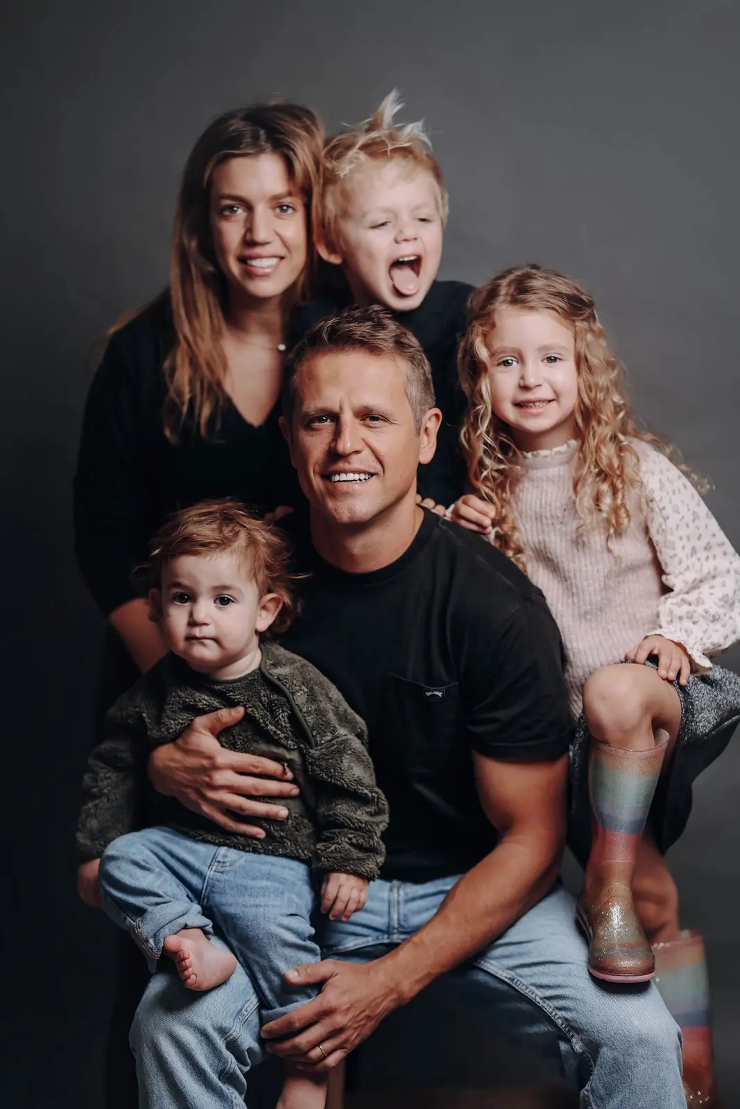 Family hug captured in studio photography