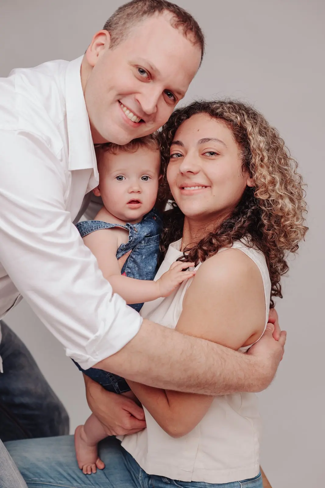 Loving gaze in family studio portraits