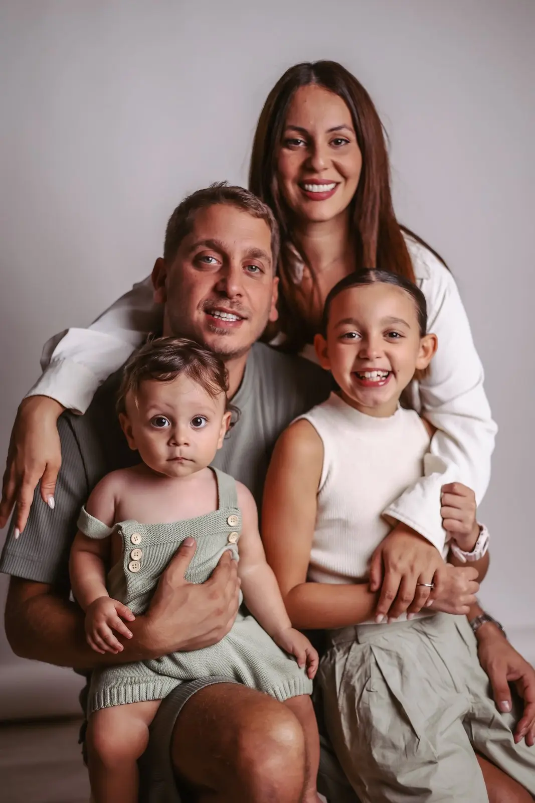 Family studio photoshoot with smiles