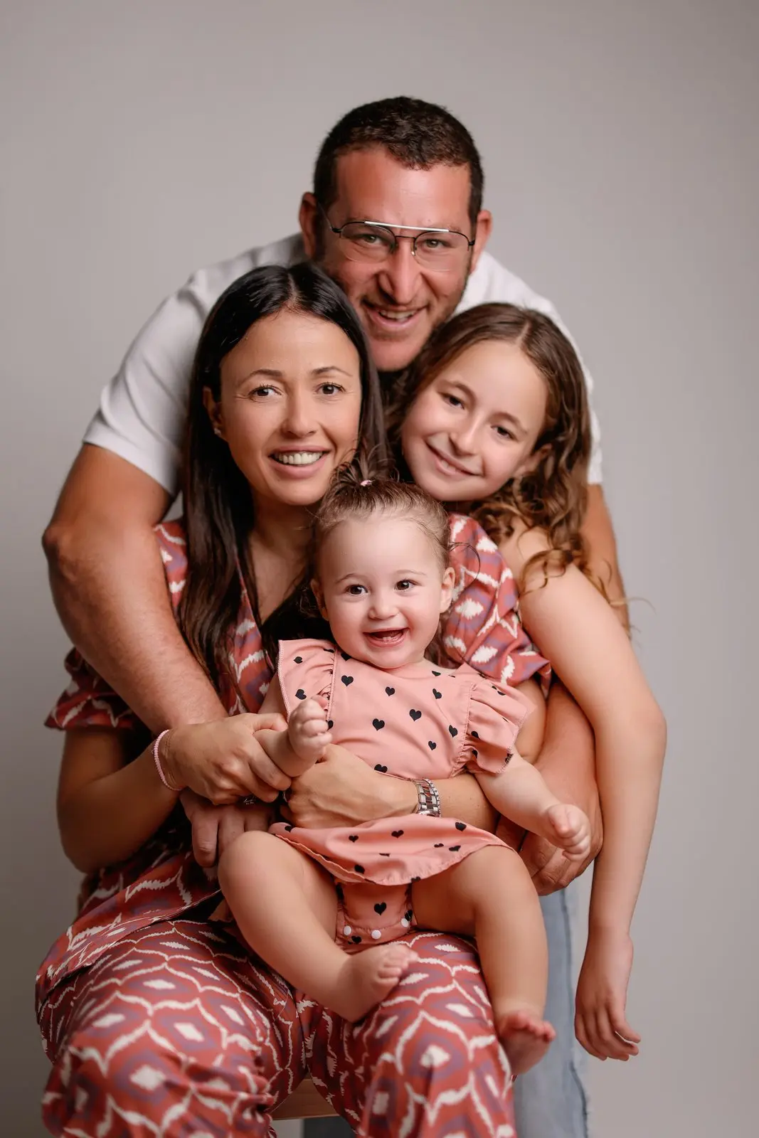 Children's laughter in family studio portraits