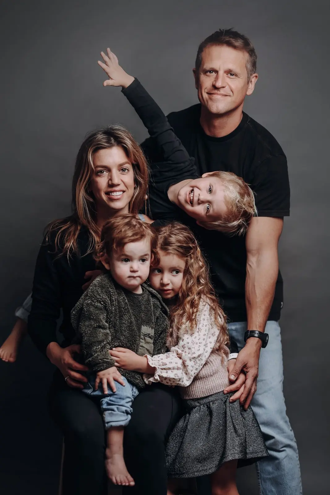 Big smiles in family studio portraits