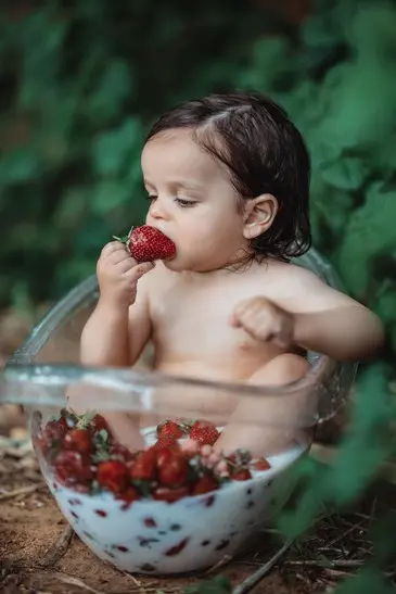 Outdoor birthday celebration with colorful props